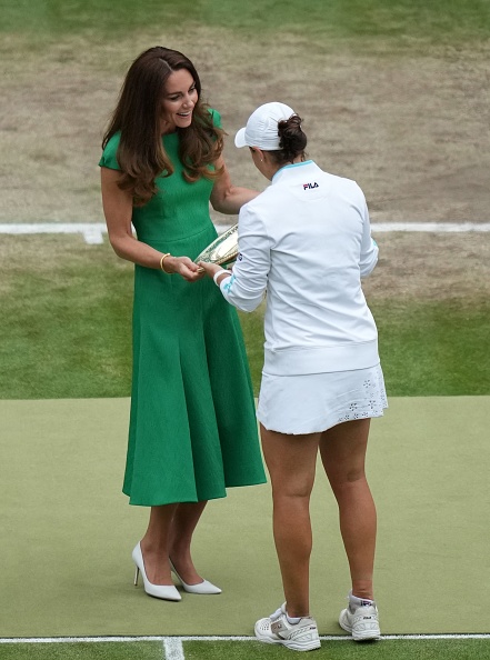 Australia's Ashleigh Barty receives the trophy from Britain's Catherine, Duchess of Cambridge, after defeating Czech Republic's Karolina Pliskova during their women's singles final match on the twelfth day of the 2021 Wimbledon Championships at The All England Tennis Club in Wimbledon, southwest London, on July 10, 2021. - RESTRICTED TO EDITORIAL USE (Photo by Mike Hewitt / POOL / AFP) / RESTRICTED TO EDITORIAL USE (Photo by MIKE HEWITT/POOL/AFP via Getty Images)